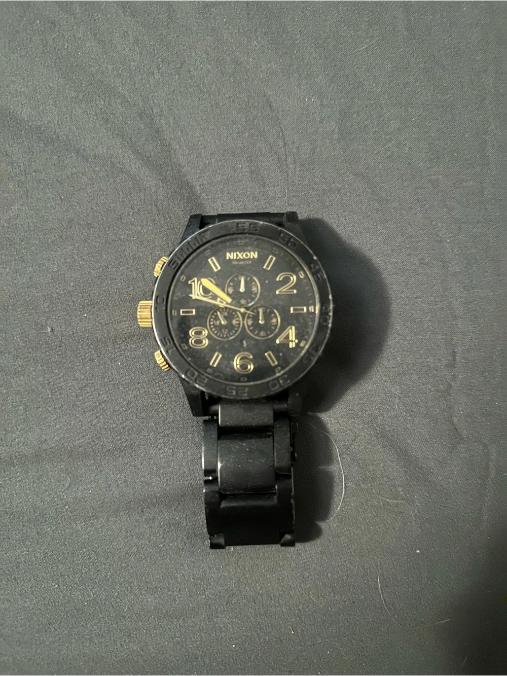 Nixon Men’s Black and Gold Chronograph Watch